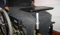 Photo of table top mounted under wheelchair cushion