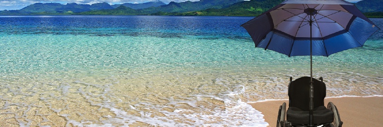 Empty chair on white sand beach, blue water with umbrella attachment.  Evokes the feeling of "wish you were there".